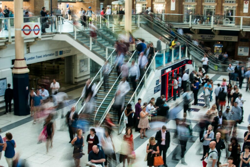 people standing and walking on stairs in mall