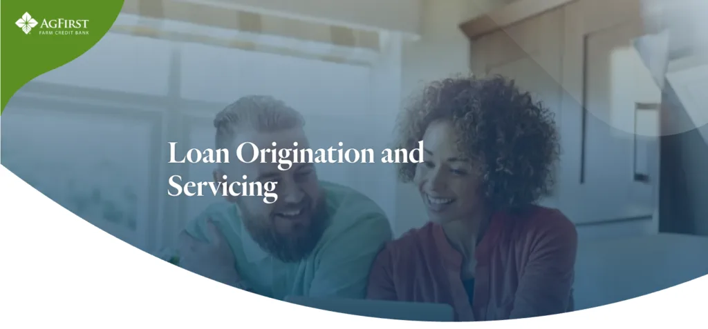 AgFirst loan origination and servicing homepage with people working on a laptop.
