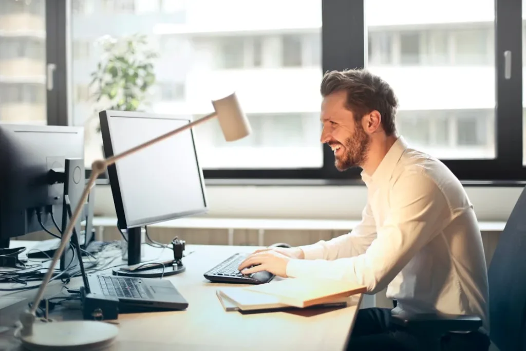 business man at computer reviewing forbearance documents