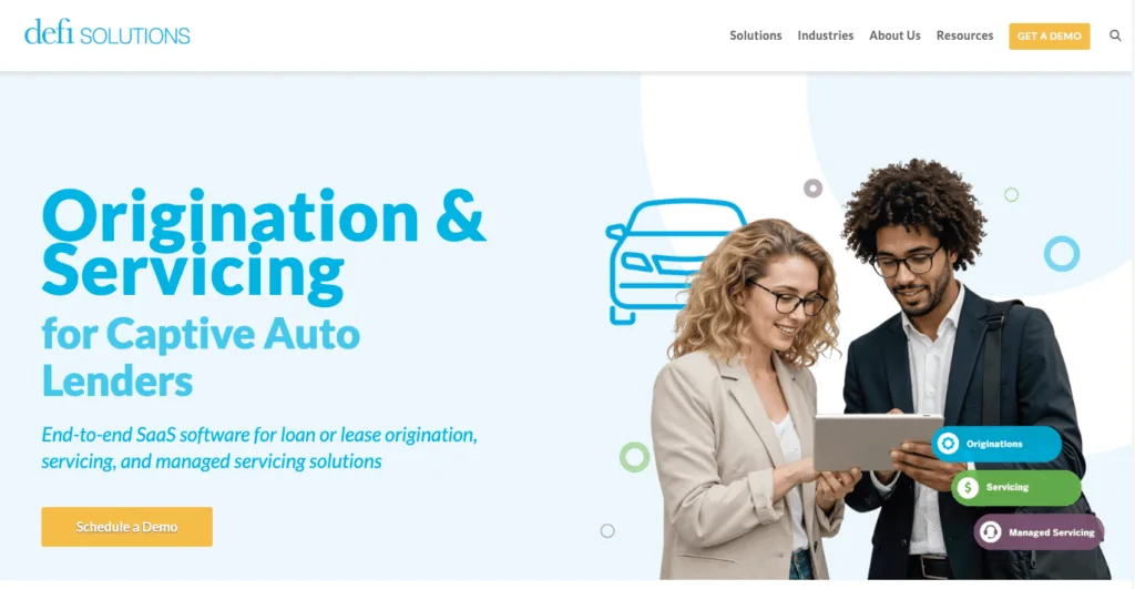 defi SOLUTIONS website screenshot for auto lending software featuring two professionals looking at a tablet.