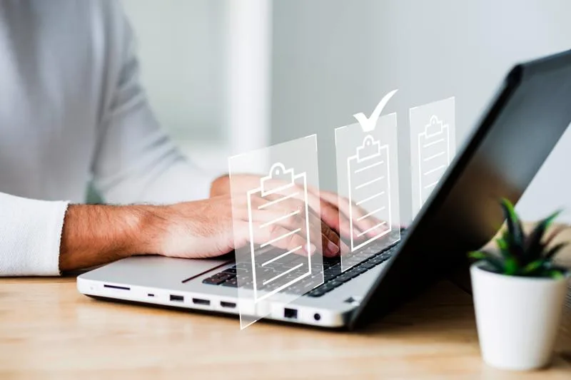 Person using laptop to manage digital documents efficiently and accurately