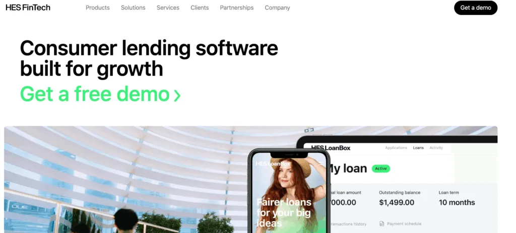 HES FinTech website screenshot for consumer lending software featuring a mobile app interface and a woman's photo.