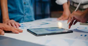 Business team selecting a loan management software during a meeting