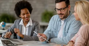 Lending team comparing loan origination software and servicing platforms