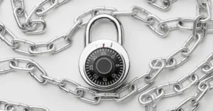 Combination padlock wrapped in metal chains symbolizing security, accuracy, and protection in lockbox payment processing.