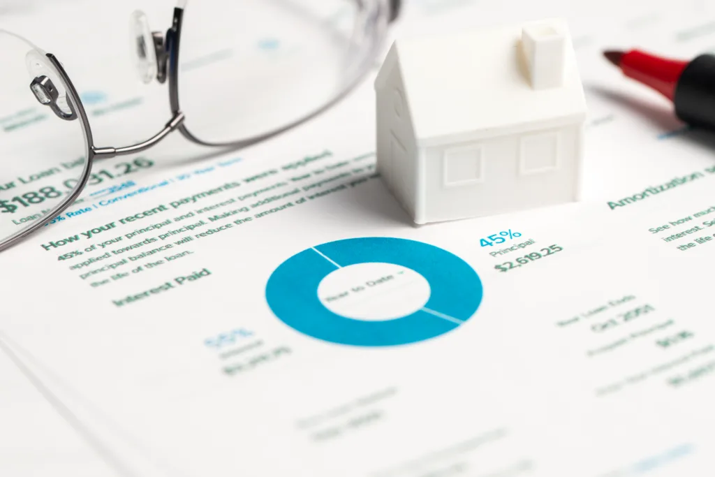 Reverse mortgage statement with home model, glasses, and payment breakdown chart.