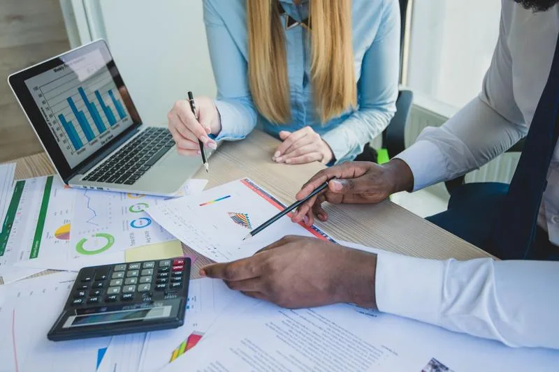 Office scene showing a discussion around multi-loan type support