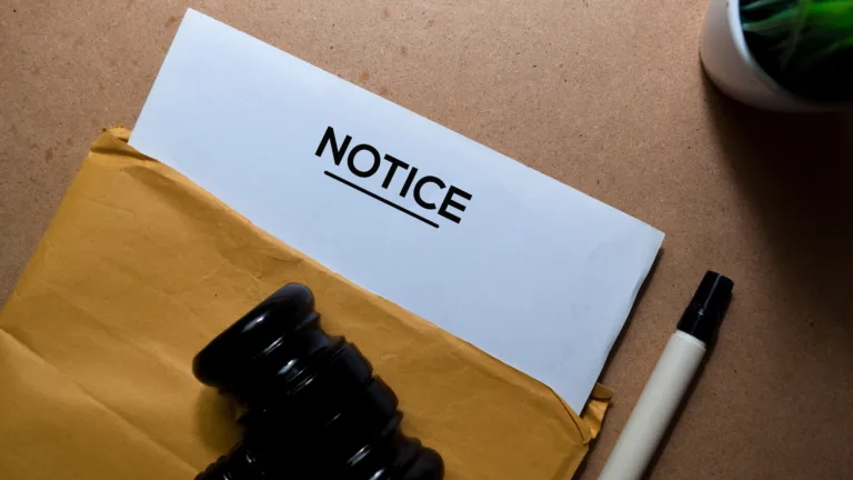 Legal notice document with a gavel, symbolizing compliance requirements for Notice of Right to Cure letters.