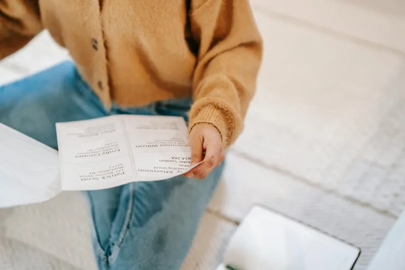 Woman reviewing payday loan agreement and state licensing requirements