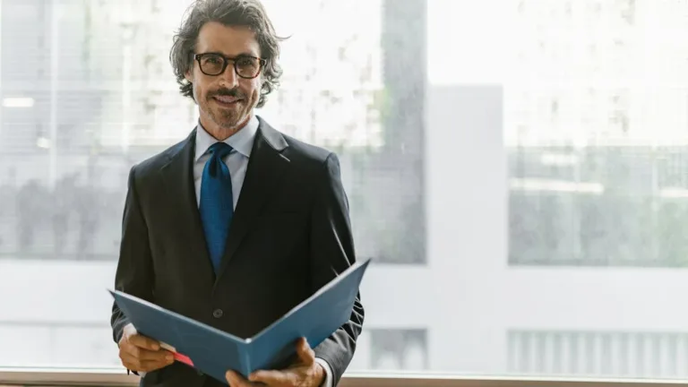 man holding a portfolio loan document in a folder