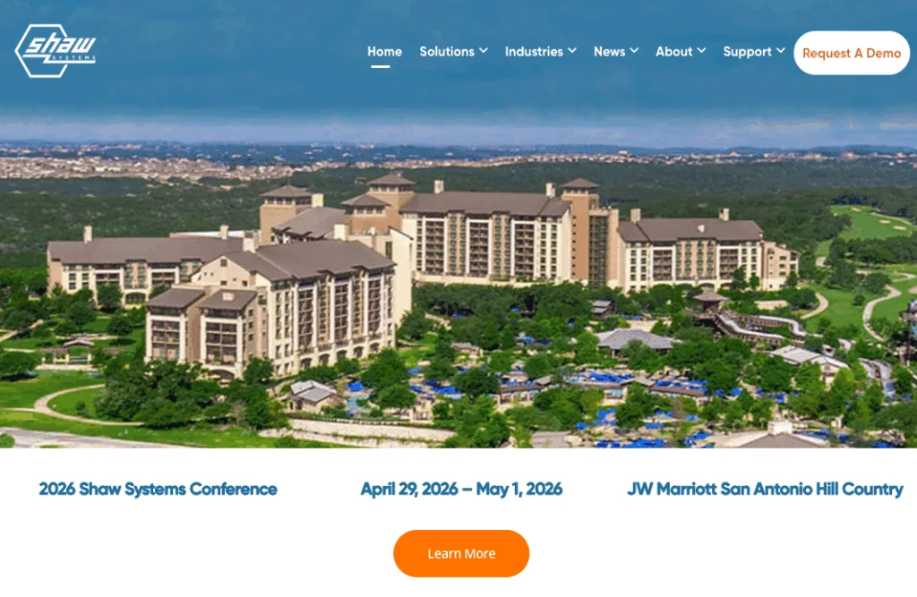 Shaw Systems homepage showing a panoramic photo of a resort, announcing the "2026 Shaw Systems Conference" with a prominent orange "Learn More" button.