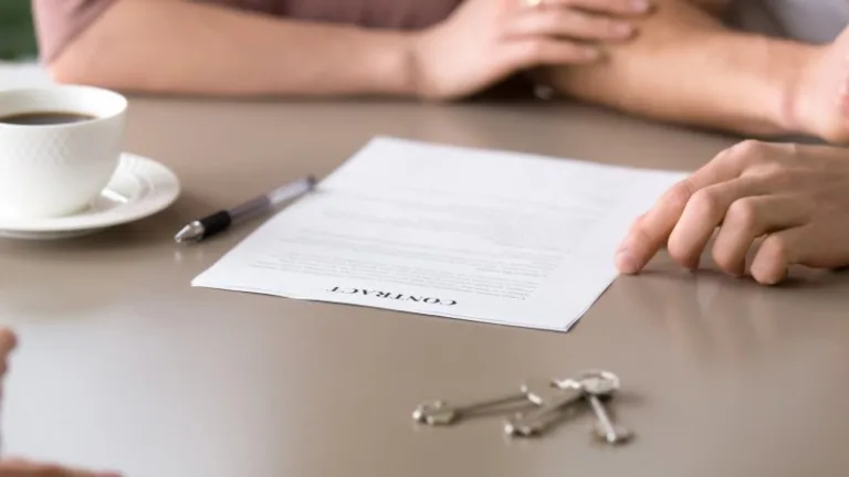 Contract with house keys on table, documenting collateral disposition notices, redemption rights, and repossession workflow.