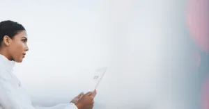 Loan servicer reviewing skip tracing results on digital contact dashboard.