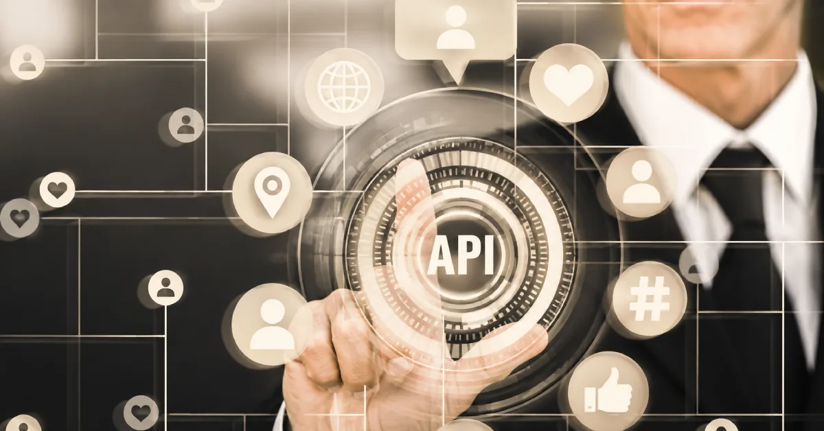Businessman touching a glowing API icon surrounded by connected digital network symbols and icons. Image color was adjusted using AI.